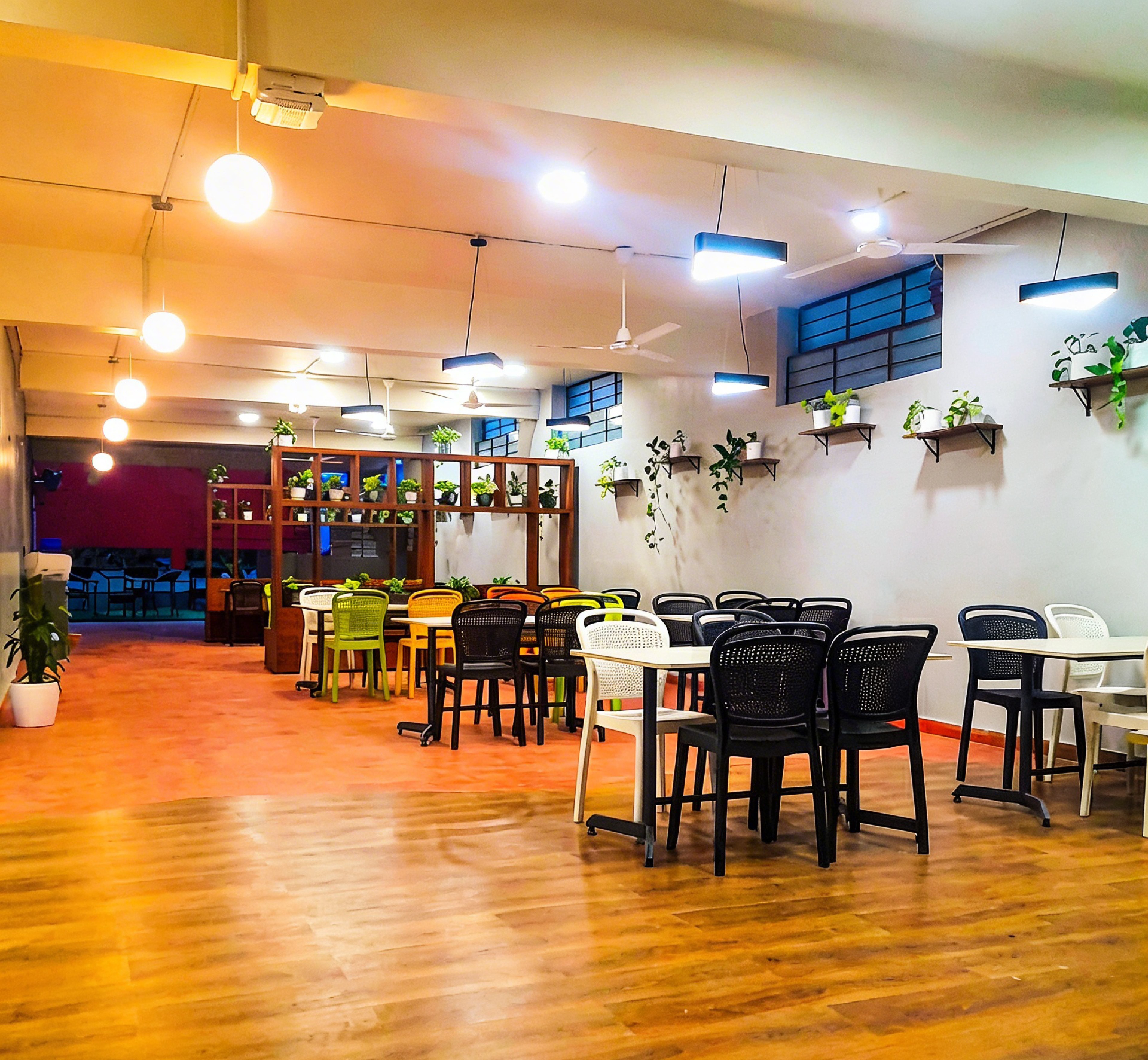 Seating arrangement with chairs, tables and plants